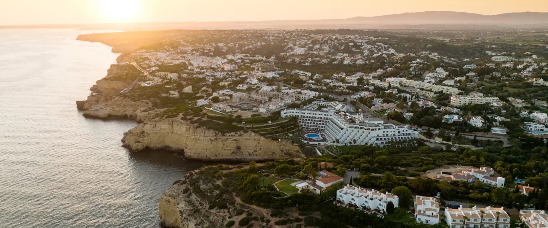 Coastal resort town photographed at sunset
