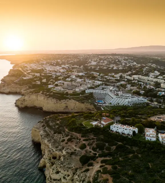 Clifftop resort overlooking the sea at sunset