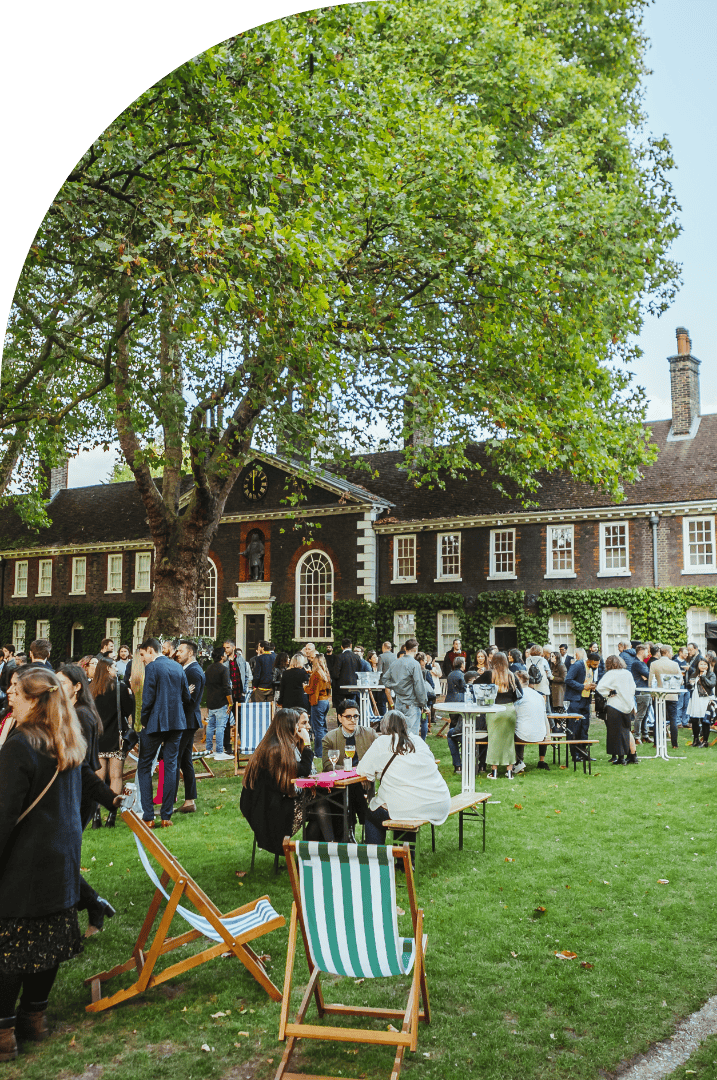Guests relaxing in deckchairs on the lawn at Shoreditch Gardens