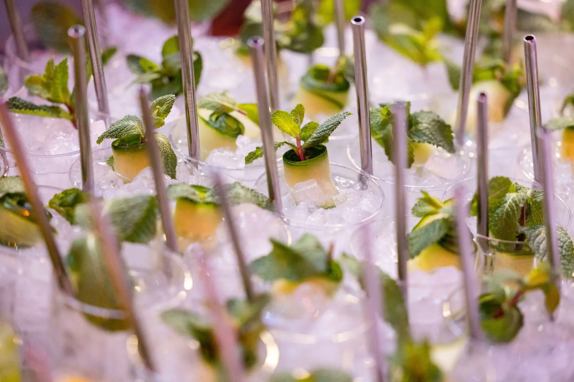 Canapés presented in glass tubes set into crushed ice