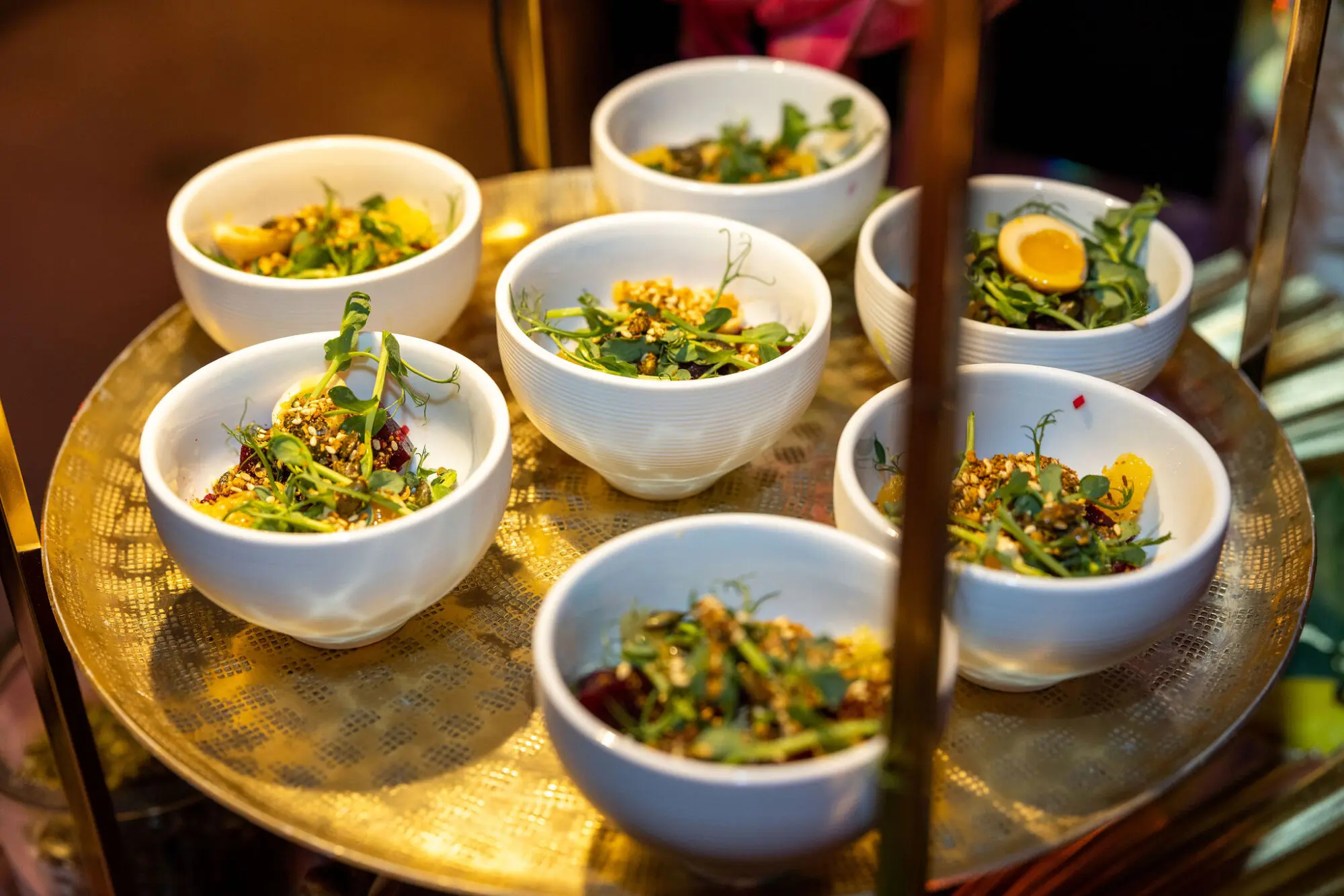 Small plates served on a gold tray