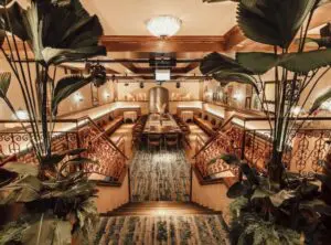 Ornate venue interior with palm planting