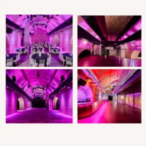 Railway arch venue lit in magenta