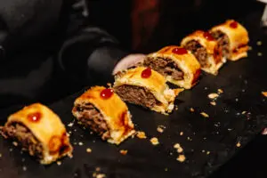 Sausage roll canapés served at a Christmas party